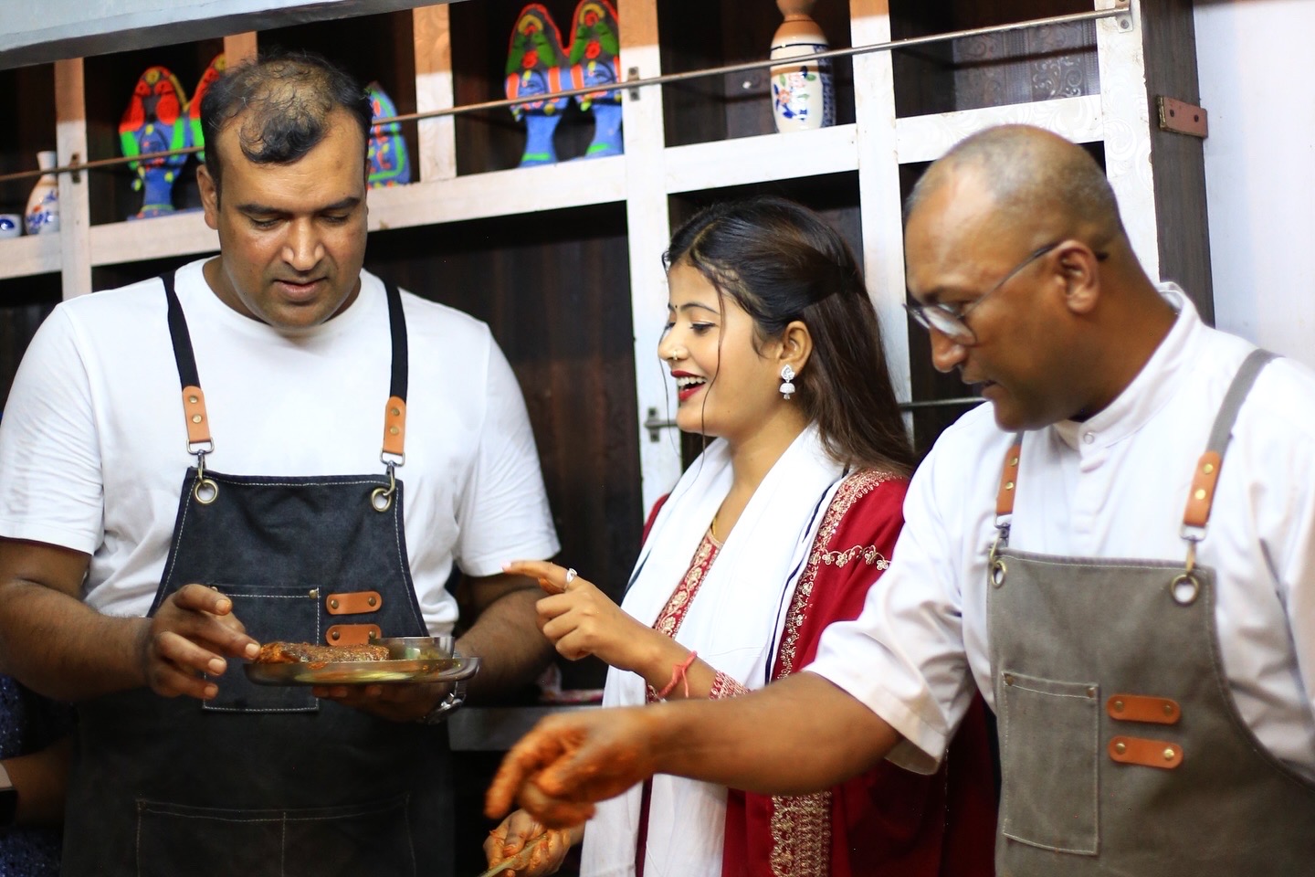 Chef Santosh Shah in the open kitchen with the guests.